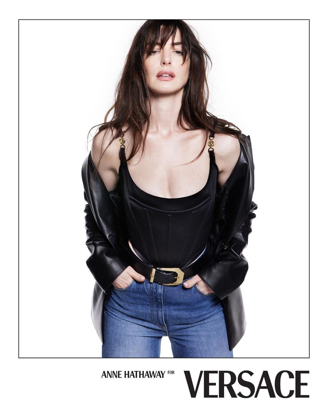 Anne Hathaway in fitted jeans and a stylish hourglass corset