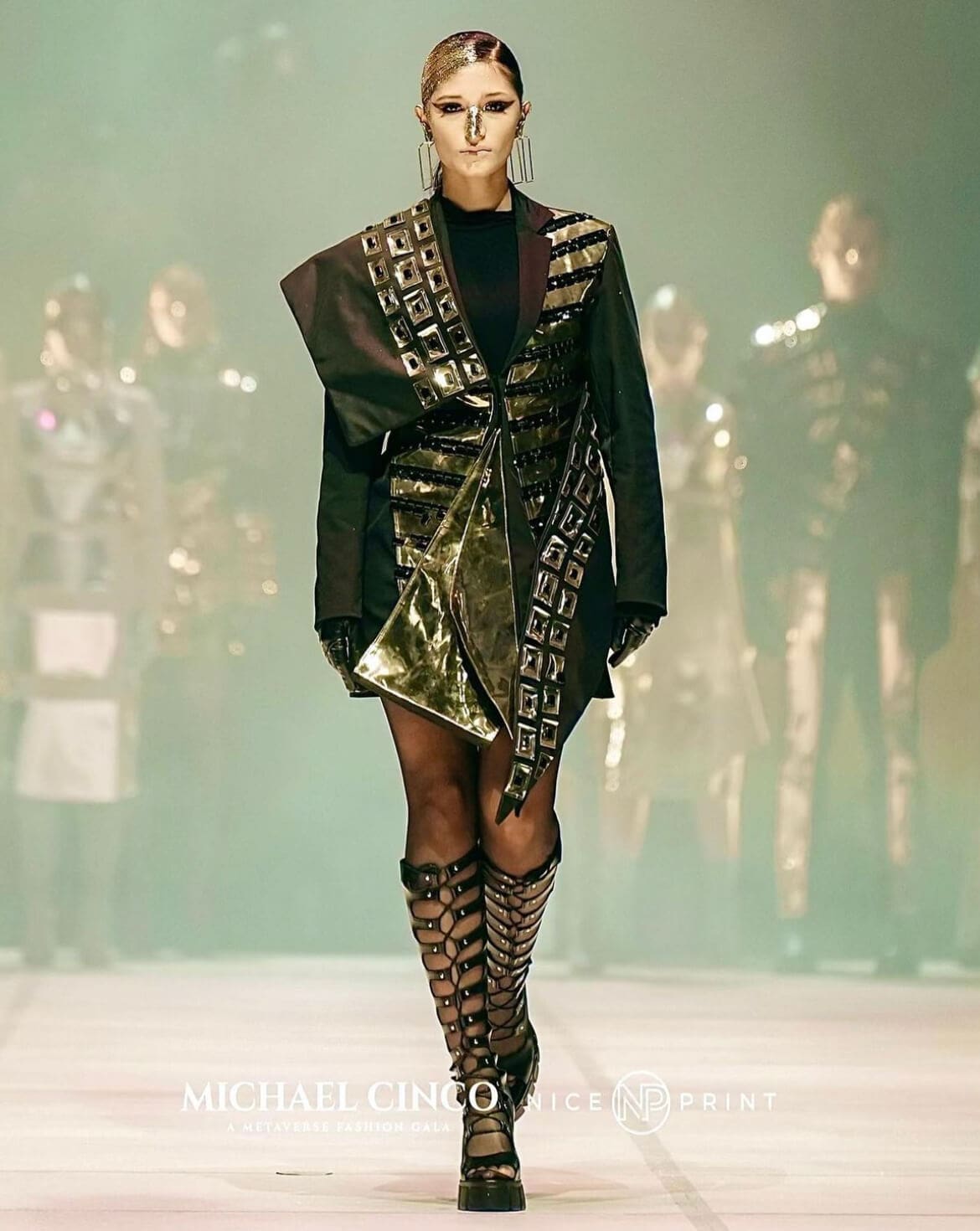 Models strut down the runway during the Michael Cinco Metaverse Fashion Gala.