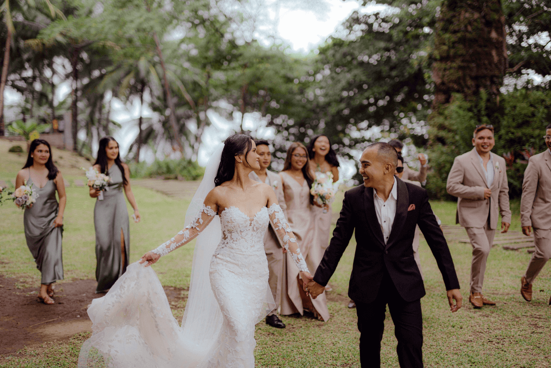 The bride and groom surrounded by loved ones