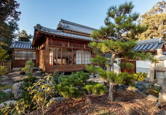 Explore the grounds to view a small garden with a pond and other landscape elements that closely resemble the compound's original setting. The rocks in the garden came directly from the original property and were placed in the exact same spots in relation to the house and a koi pond.