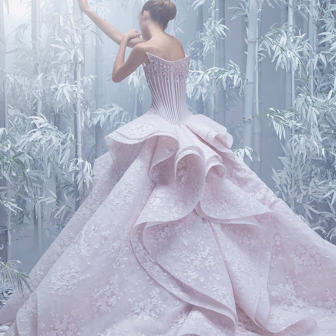 A wedding dress with dramatic layers and embroidered floral patterns