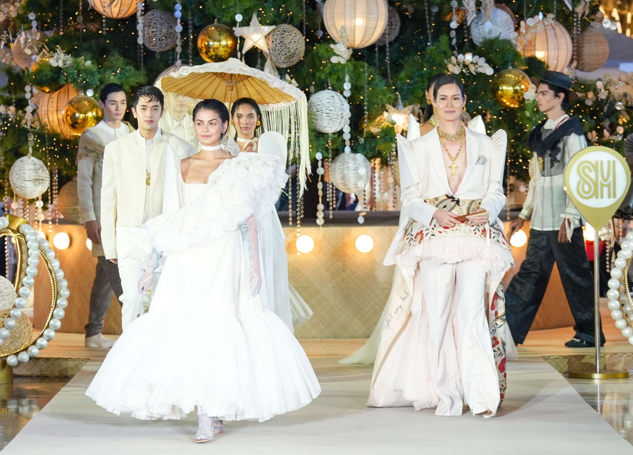 Janine Gutierrez (left, front) and Jo Ann Bitagcol (right), with David Licauco (left, back), elegantly showcase the creations of renowned fashion designer Joey Samson