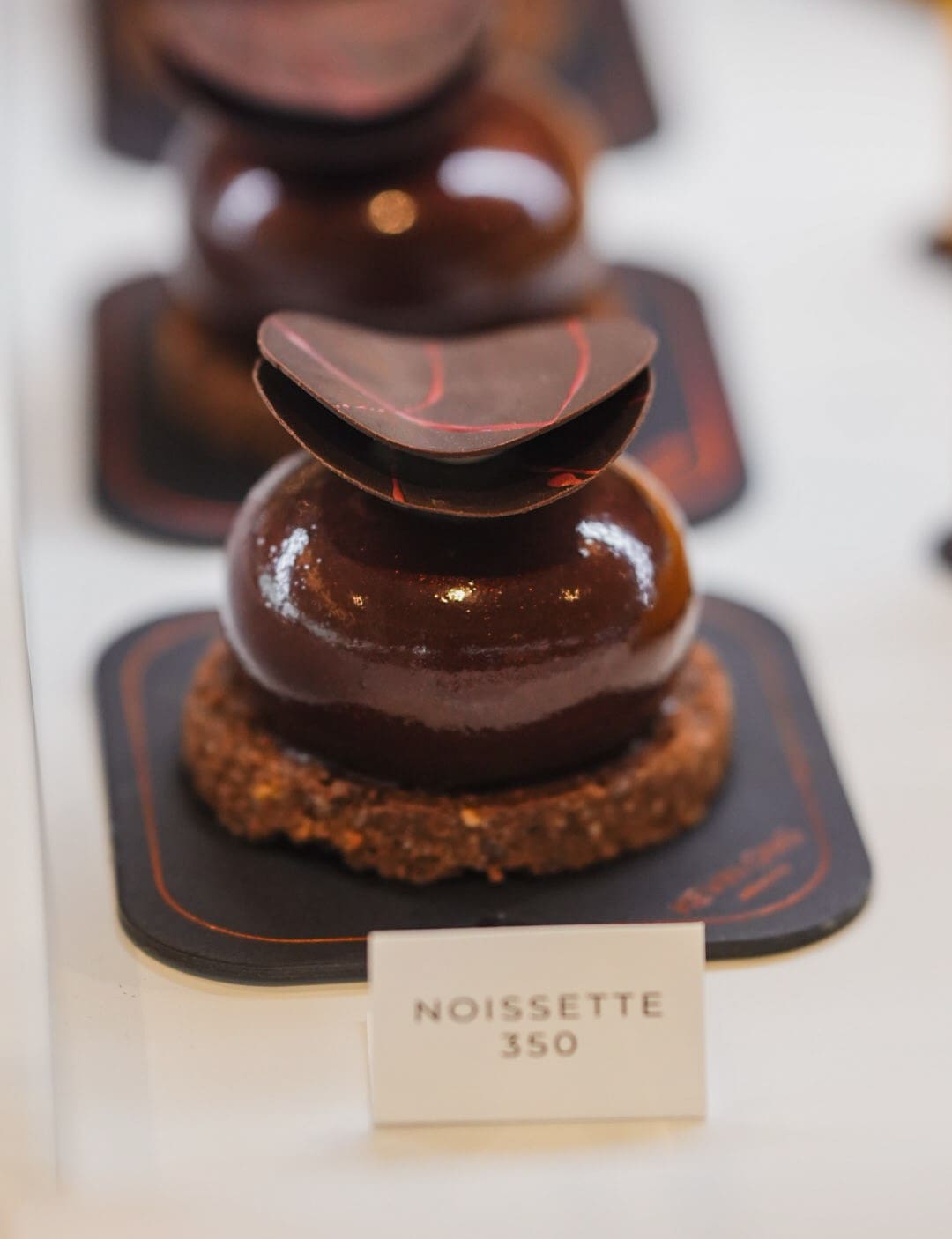 LEFT: Kevin Ong Patisserie’s Noissette hazelnut dessert; RIGHT: Cinnabon classic swirls