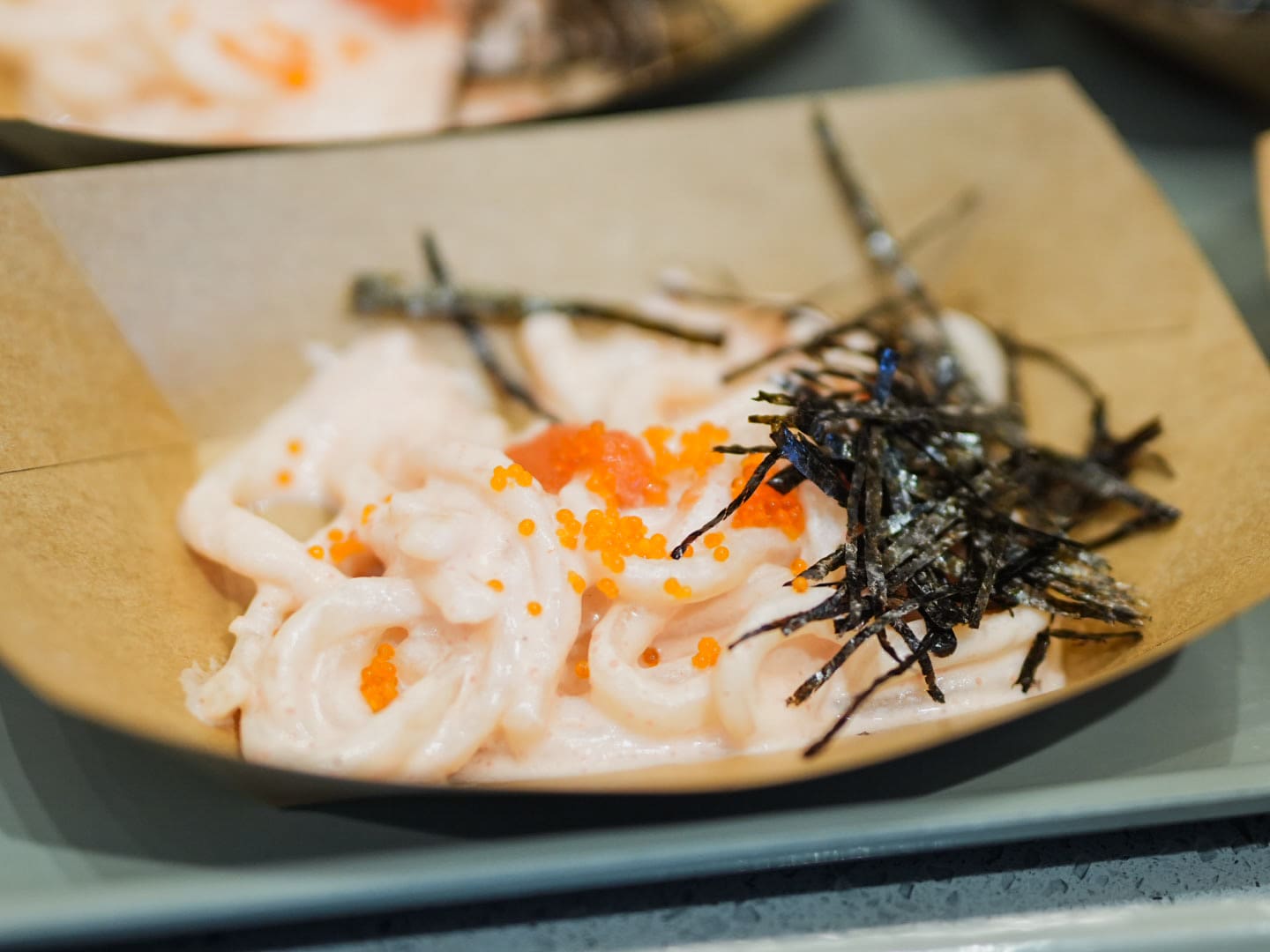 TOP RIGHT: Sushi Nori’s Salmon Overload Bento with Salmon Cream Cheese, Salmon Nigiri, and Salmon Sashimi ; TOP LEFT: Sizzling Plate’s meal; BOTTOM RIGHT: A Pepper Lunch meal; BOTTOM LEFT: Nadai Fujisoba’s savory Udon noodles