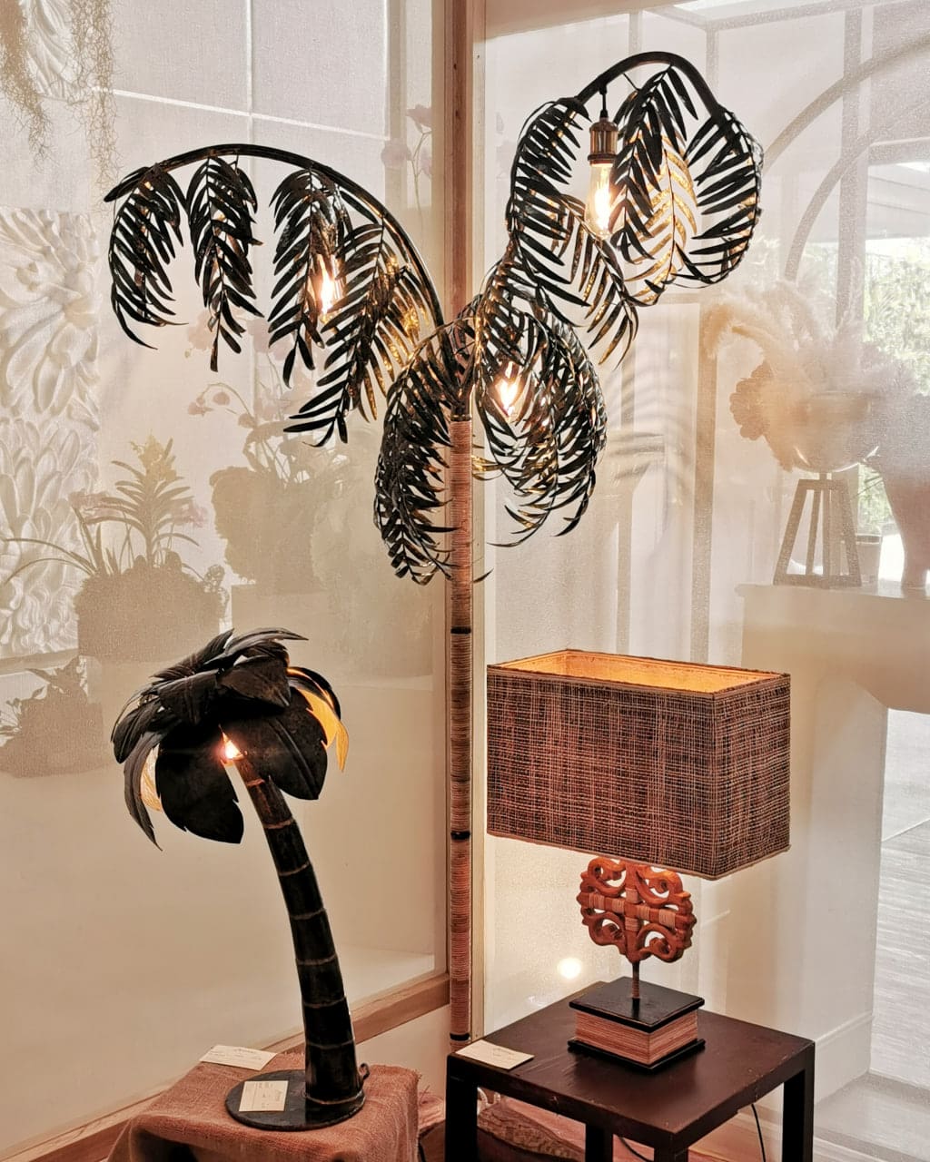 From left to right: Mini Coco in handcut and hammered metal cans; Mr Palmer; and Ukit in mahogany wood from felled trees with abaca shade