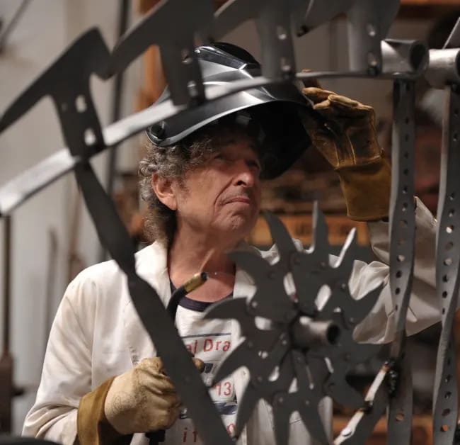 Bob Dylan working on his ironwork sculpture/Photo from the Bob Dylan website