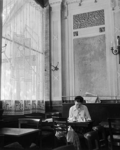 Simone de Beauvoir writing in Les Deux Magots