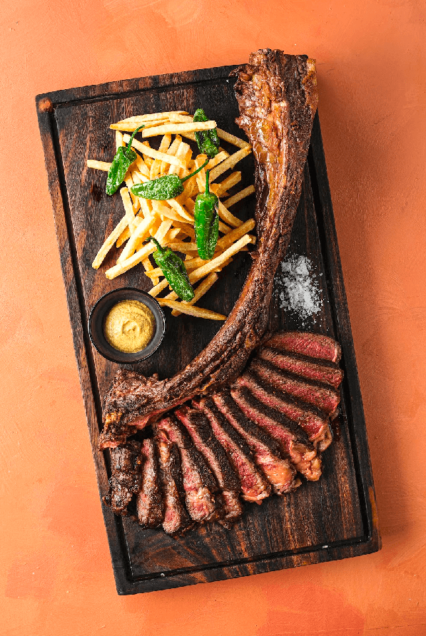 TOP (L-R): Beef Tomahawk; Slow Cooked Truffle Honey Iberico Pork Ribs. LEFT (L-R): Yellowfin Tuna Carpaccio; Parmesan Cheese and Bacon Croquetas.