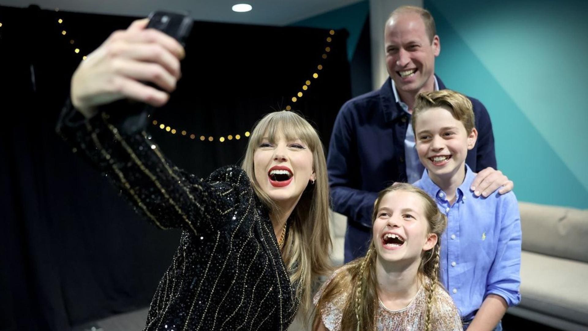 Swift poses with Prince William, Prince George, and Princess Charlotte