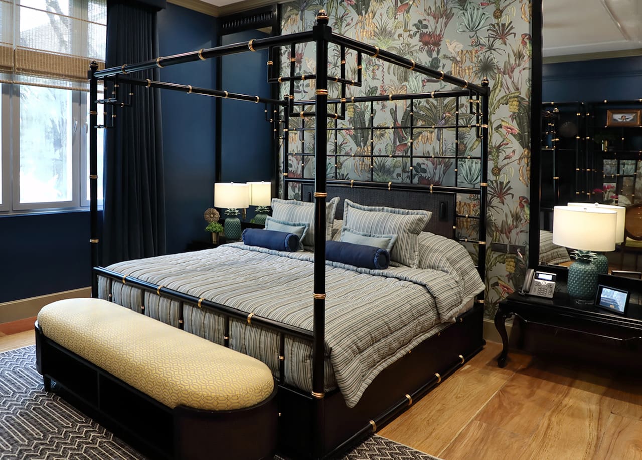 LEFT: The Gloria Macapagal-Arroyo Room at Laperal Mansion, Arlegui Guest House. RIGHT: A traditional-style dining room featuring a hand-painted wall by Tara Soriano that provides an idyllic backdrop for the vintage and custom made furniture.