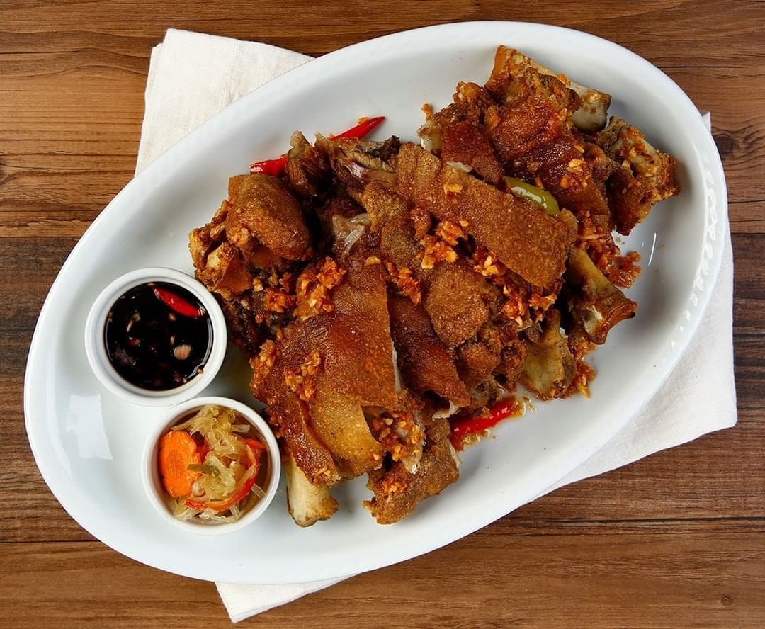 TOP LEFT: Bistek Tagalog ng Kano. TOP RIGHT: Crispy Patang Bawang. BOTTOM LEFT: Tilapia with Sweet Plum Sauce. BOTTOM RIGHT: Sisig Fried Rice.