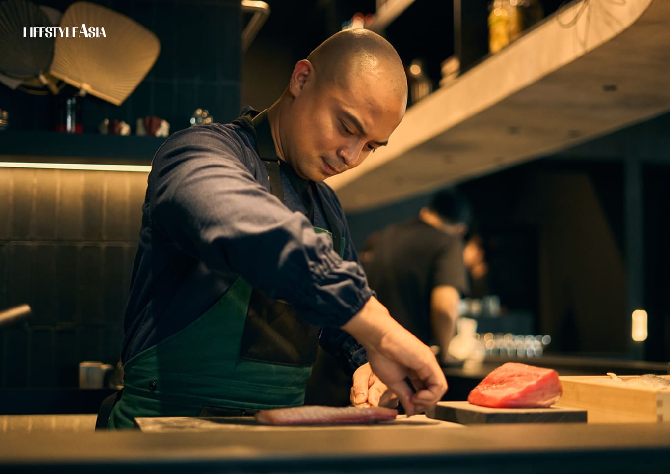 Chef Bruce cutting slabs of fresh tuna before the evening's service