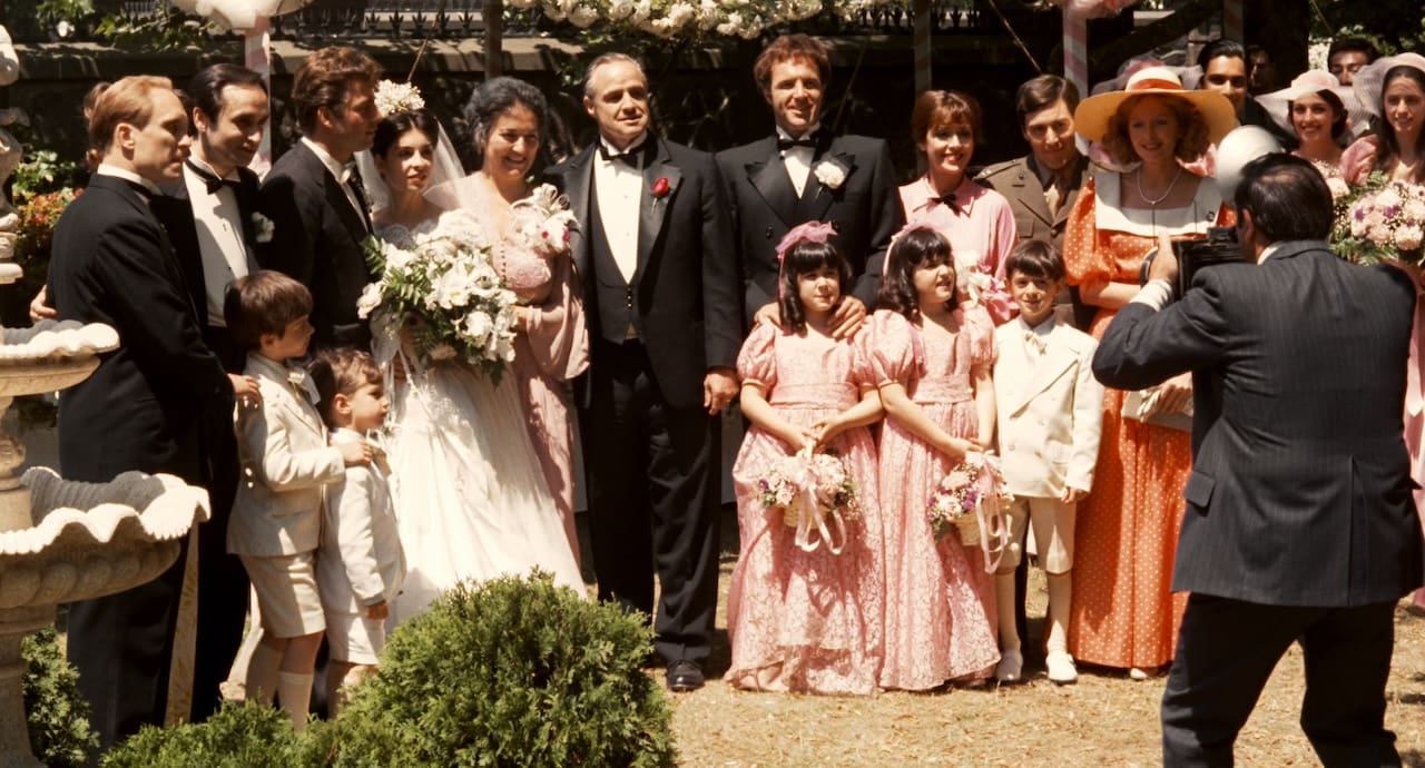 The fictional Corleone family poses for a group photo in the opening sequence of "The Godfather"
