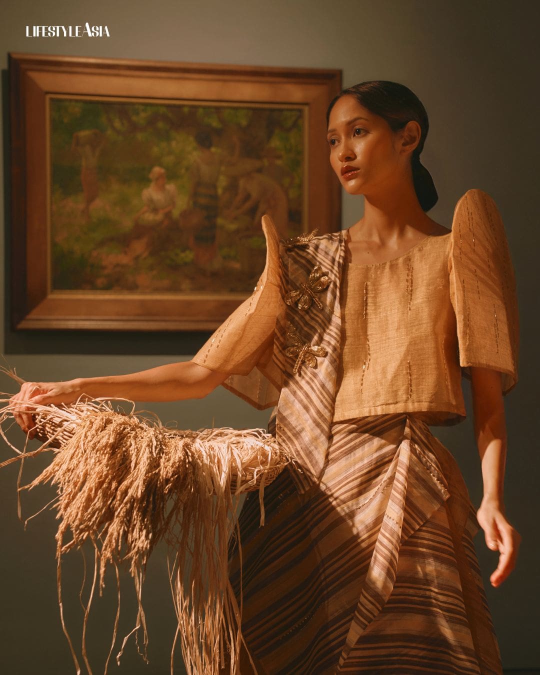 “Under the Mango Tree” (1935) by Fernando Amorsolo, from the collection of the Government Service Insurance System; Terno by Ram Silva, Ramon Valera (Bronze) awardee of TernoCon 2025, inspired by the countryside splendor of Amorsolo, incorporating handwoven fabrics and natural fibers artists