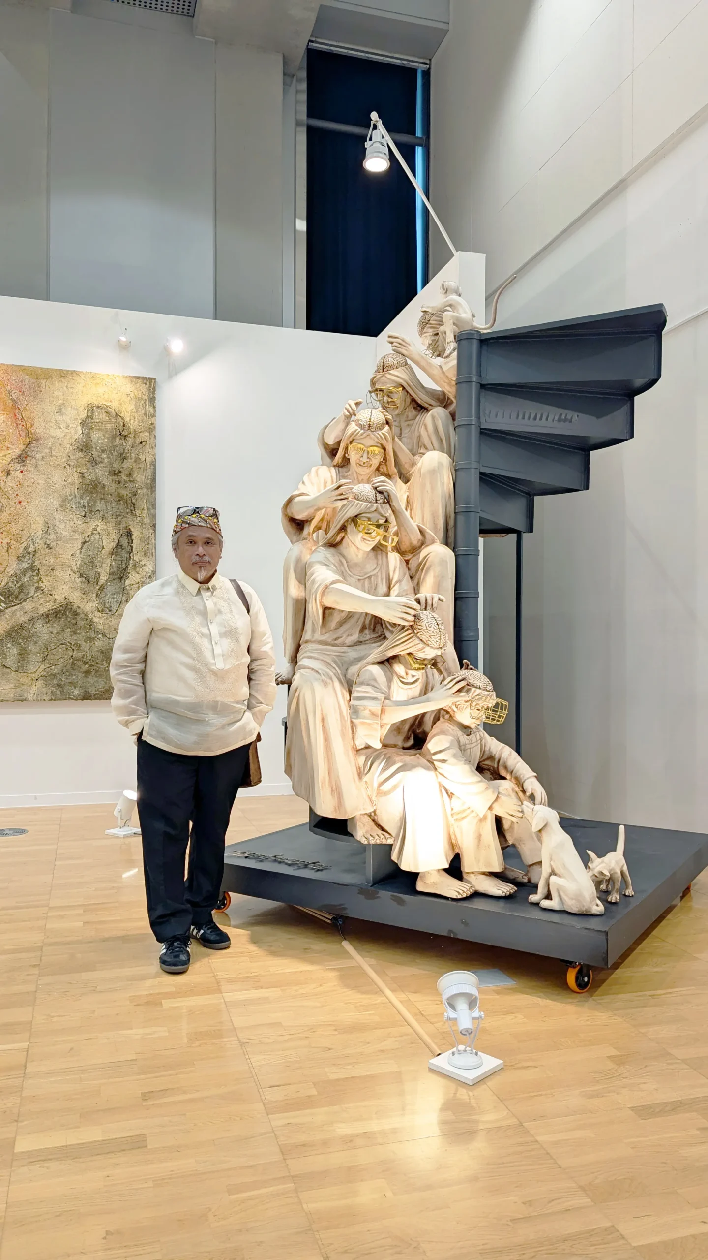 Toym Imao next to his sculpture "Debugging," which was featured in the 14th Gwangju Biennale