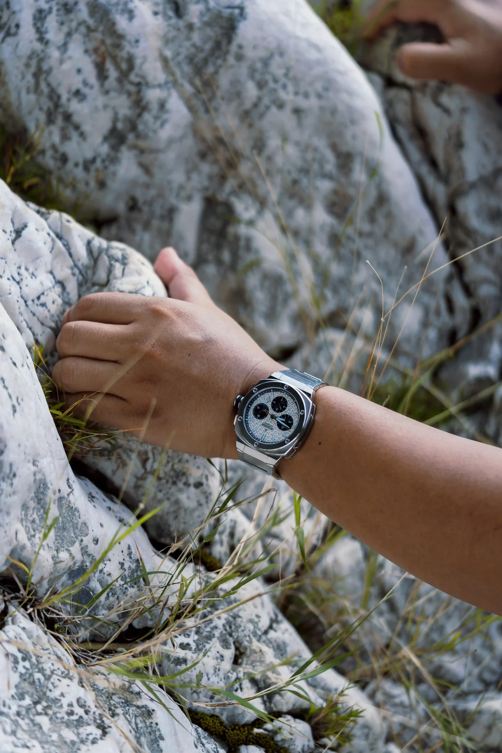 Jeno Panganiban climbs mountains in an Alpina Alpiner Extreme Chronograph Automatic
